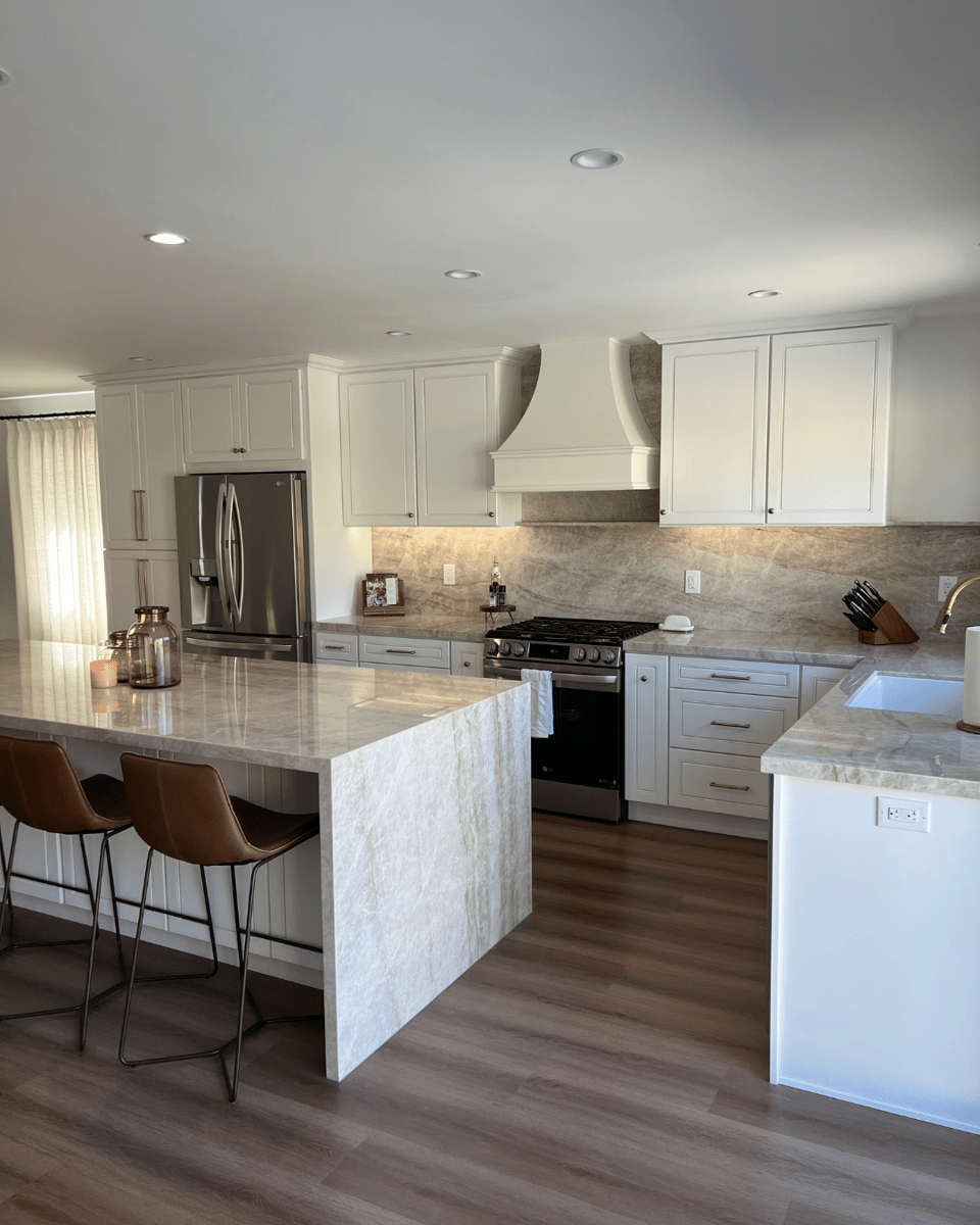 renovated-kitchen-oversized-island-stone-countertops-backsplash-1